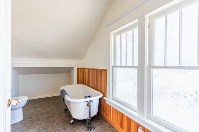 1046 3rd Ave E, Kalispell, MT 59901 - bathroom featuring healthy amount of natural light, a soaking tub, and lofted ceiling