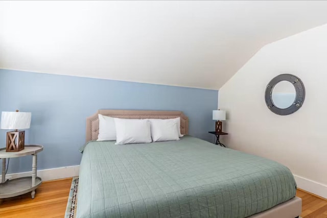 1046 3rd Ave E, Kalispell, MT 59901 - bedroom with lofted ceiling and wood finished floors