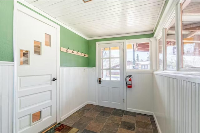 1046 3rd Ave E, Kalispell, MT 59901 - doorway with stone tile floors and wainscoting