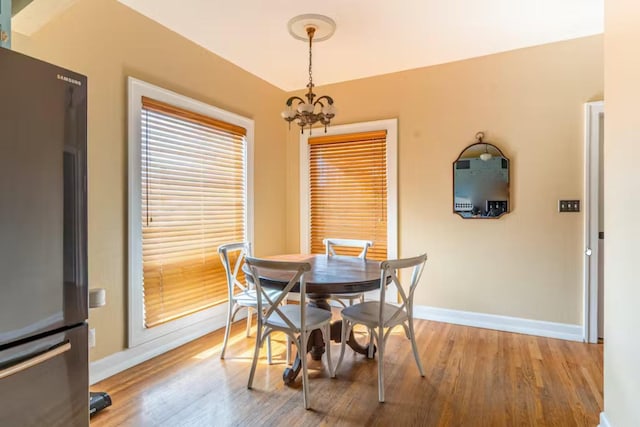 1046 3rd Ave E, Kalispell, MT 59901 - dining space with a chandelier and light wood-style flooring