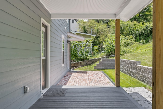 wooden deck with a yard