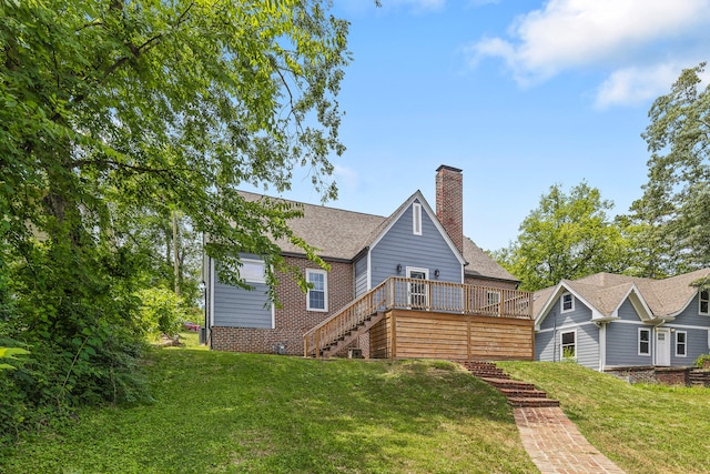 back of house with a wooden deck and a yard