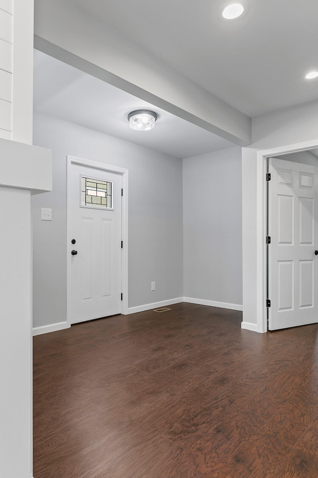 entryway with dark wood-type flooring