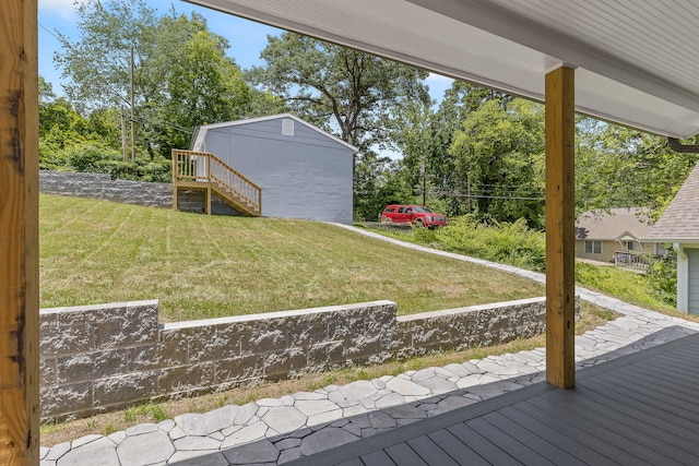 view of yard with a storage unit and a wooden deck