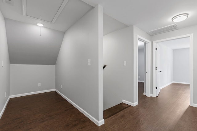 bonus room featuring dark hardwood / wood-style flooring and lofted ceiling