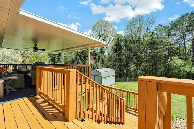 2506 Cindy St, Athens, TN 37303 - wooden deck with a ceiling fan, a yard, an outbuilding, and a shed