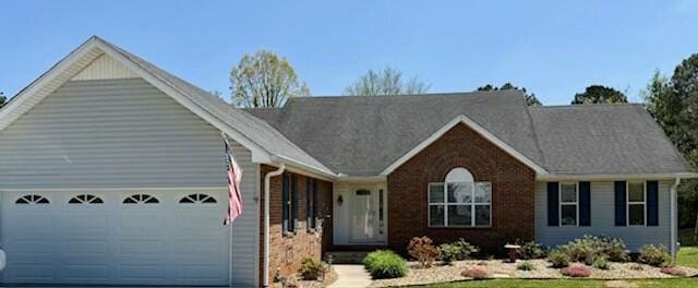 2506 Cindy St, Athens, TN 37303 - single story home with an attached garage, concrete driveway, and brick siding