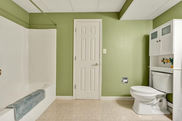2506 Cindy St, Athens, TN 37303 - bathroom featuring toilet, baseboards, and shower / tub combination