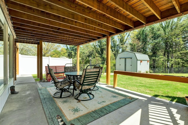 2506 Cindy St, Athens, TN 37303 - view of patio with a storage shed, outdoor dining space, an outbuilding, and view of scattered trees