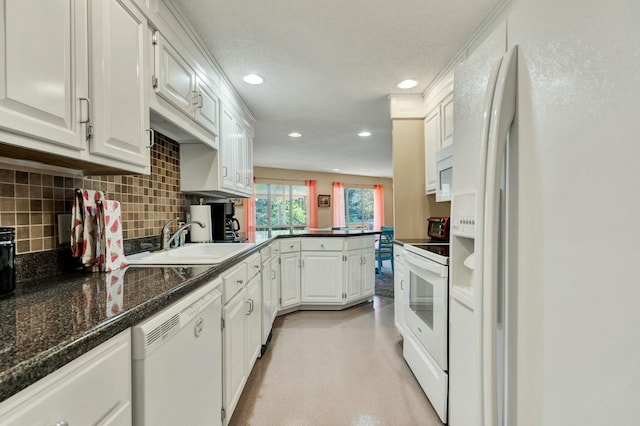 2506 Cindy St, Athens, TN 37303 - kitchen featuring white appliances, a sink, recessed lighting, a peninsula, and white cabinets