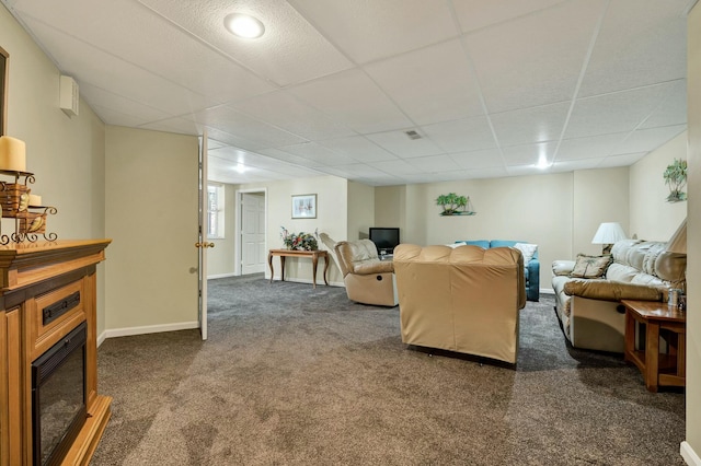 2506 Cindy St, Athens, TN 37303 - carpeted living area with a fireplace, a paneled ceiling, and baseboards
