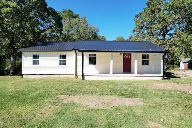 view of front of home featuring a front lawn and covered porch