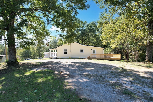 view of side of home featuring a deck