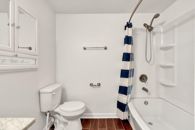 bathroom featuring shower / bath combo, hardwood / wood-style flooring, and toilet