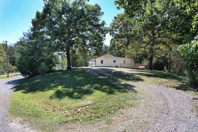 ranch-style home featuring a front yard