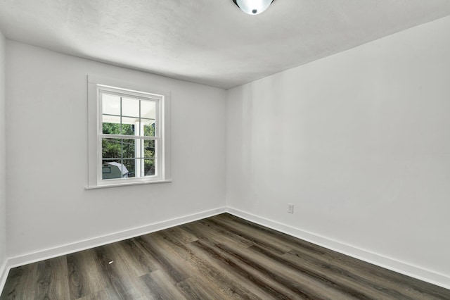 empty room featuring dark hardwood / wood-style floors