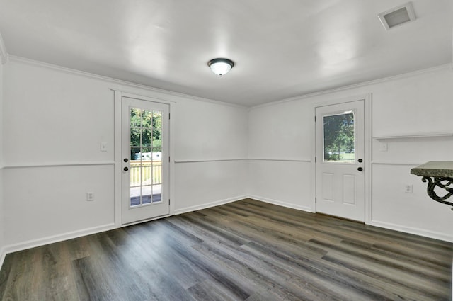 interior space with ornamental molding and dark wood-type flooring