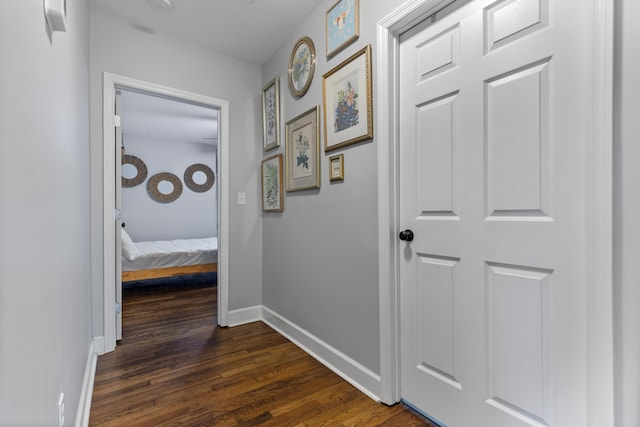 hall with dark wood-type flooring