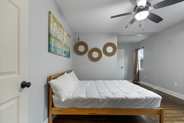 bedroom with ceiling fan and dark hardwood / wood-style flooring