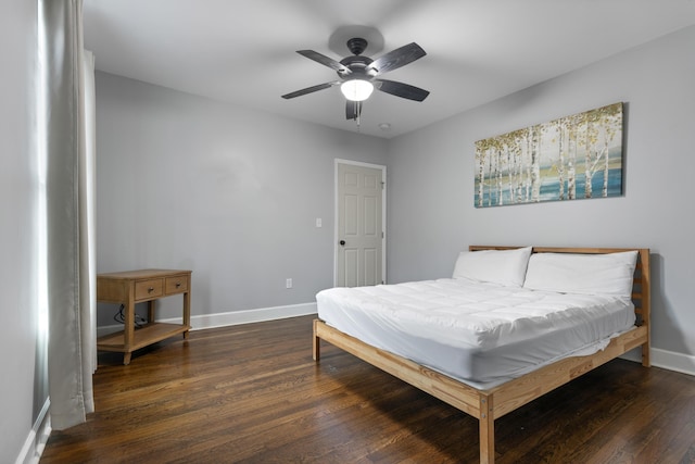 bedroom with ceiling fan and dark hardwood / wood-style flooring