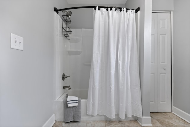 bathroom featuring shower / bath combo with shower curtain