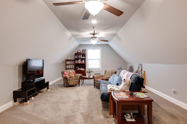 sitting room with lofted ceiling, a ceiling fan, baseboards, and carpet floors