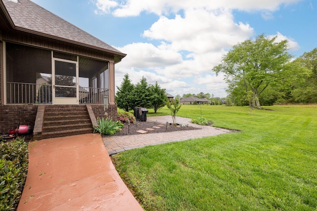 view of yard with a sunroom
