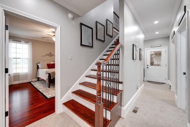 staircase featuring ceiling fan, recessed lighting, ornamental molding, and baseboards