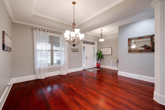 interior space featuring baseboards, wood finished floors, and an inviting chandelier