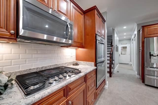 kitchen with brown cabinets, decorative backsplash, stainless steel appliances, baseboards, and recessed lighting
