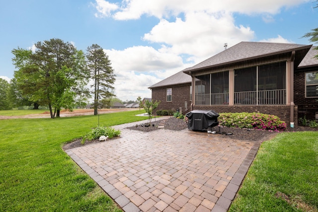 view of patio with a sunroom