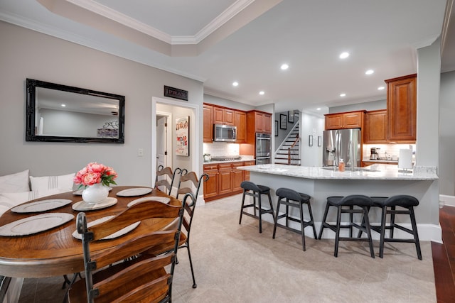 dining space with baseboards, recessed lighting, stairs, and crown molding