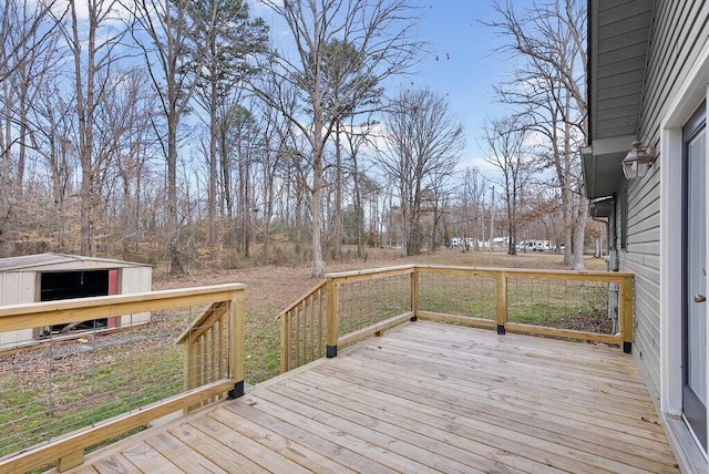 wooden terrace featuring an outdoor structure