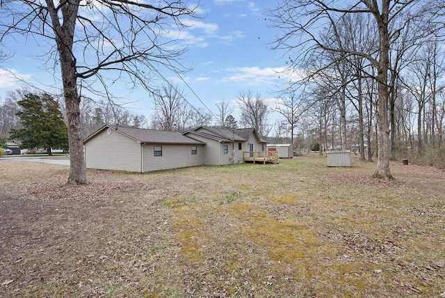 view of yard with a wooden deck