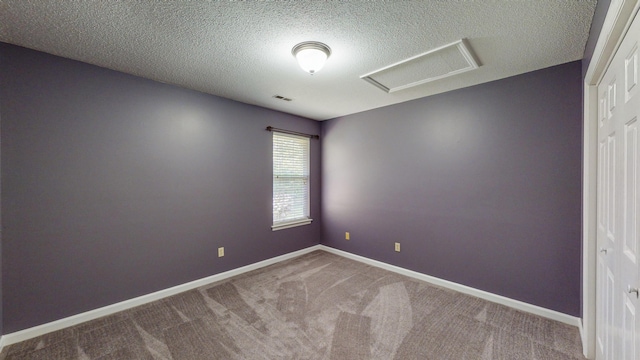 519 Cedar Glen Cir, Chattanooga, TN 37412 - unfurnished room featuring attic access, carpet floors, a textured ceiling, and baseboards