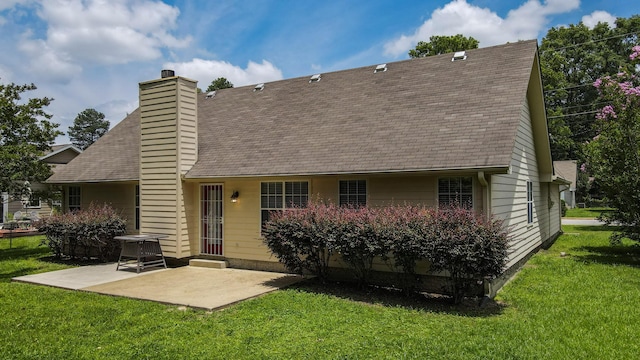 519 Cedar Glen Cir, Chattanooga, TN 37412 - back of house with a chimney, a patio, roof with shingles, and a yard