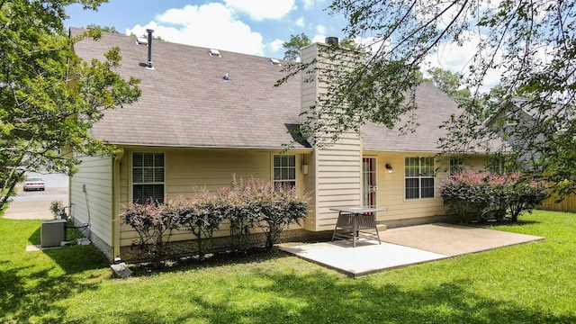 519 Cedar Glen Cir, Chattanooga, TN 37412 - rear view of house with a patio area, a yard, a chimney, and a shingled roof