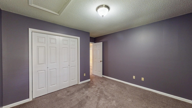 519 Cedar Glen Cir, Chattanooga, TN 37412 - unfurnished bedroom featuring carpet floors, a closet, baseboards, attic access, and a textured ceiling