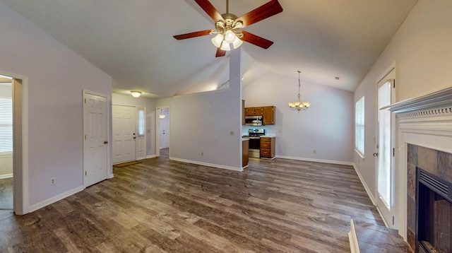 519 Cedar Glen Cir, Chattanooga, TN 37412 - unfurnished living room featuring a fireplace, vaulted ceiling, dark wood-style floors, a ceiling fan, and a chandelier