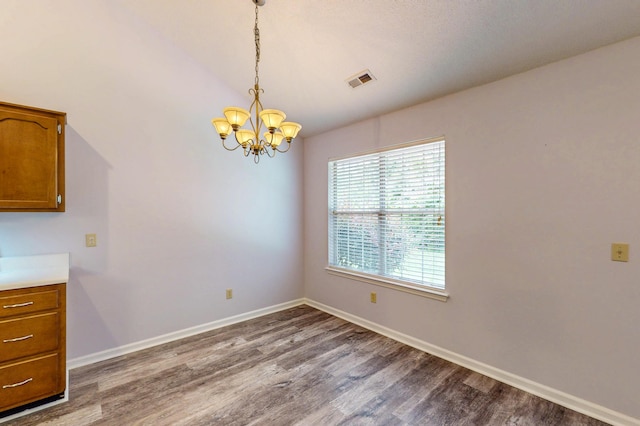 519 Cedar Glen Cir, Chattanooga, TN 37412 - unfurnished dining area featuring a chandelier, dark wood finished floors, baseboards, and lofted ceiling