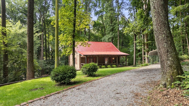 144 Low Brook Ct NE, Cleveland, TN 37312 - surrounding community featuring driveway, a yard, a carport, and a view of trees