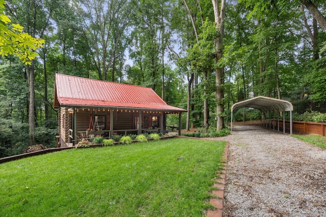 144 Low Brook Ct NE, Cleveland, TN 37312 - view of grassy yard featuring a carport, a porch, and driveway
