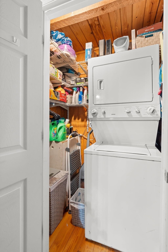 144 Low Brook Ct NE, Cleveland, TN 37312 - washroom with stacked washing machine and dryer and wood finished floors