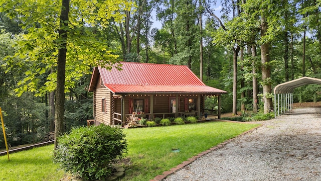 144 Low Brook Ct NE, Cleveland, TN 37312 - surrounding community with a yard, a detached carport, and gravel driveway