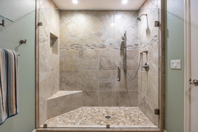 bathroom featuring an enclosed shower