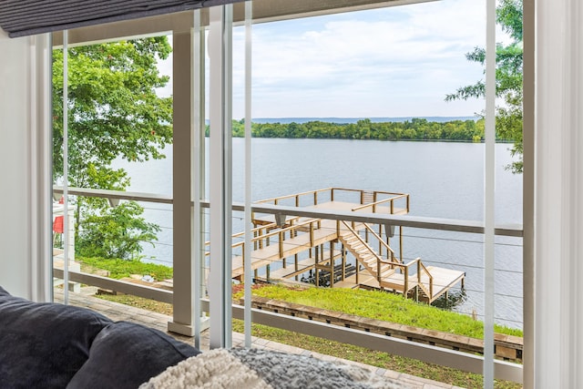 dock area featuring a water view and a balcony