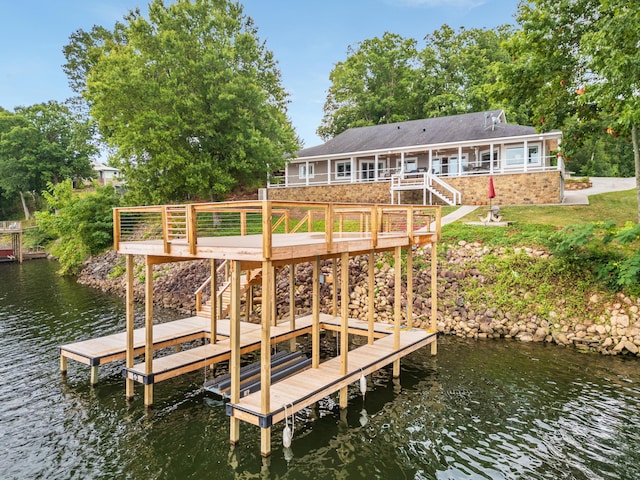 dock area with a deck with water view