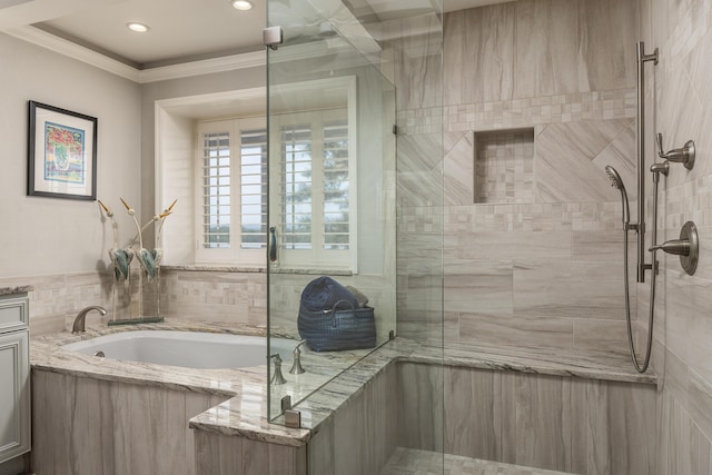 bathroom featuring shower with separate bathtub, vanity, and ornamental molding