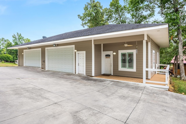 single story home featuring ceiling fan and a garage