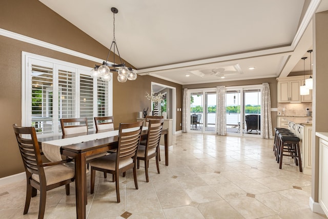 tiled dining space featuring a notable chandelier, lofted ceiling, and crown molding